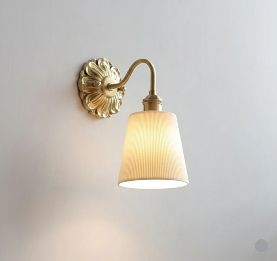 Vintage ceramic wall light with ribbed shade and warm brass