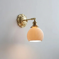 Elegant vintage wall lamp made of opal glass with a rotating brass arm