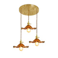 Three-bulb amber glass pendant light in an elegant vintage style