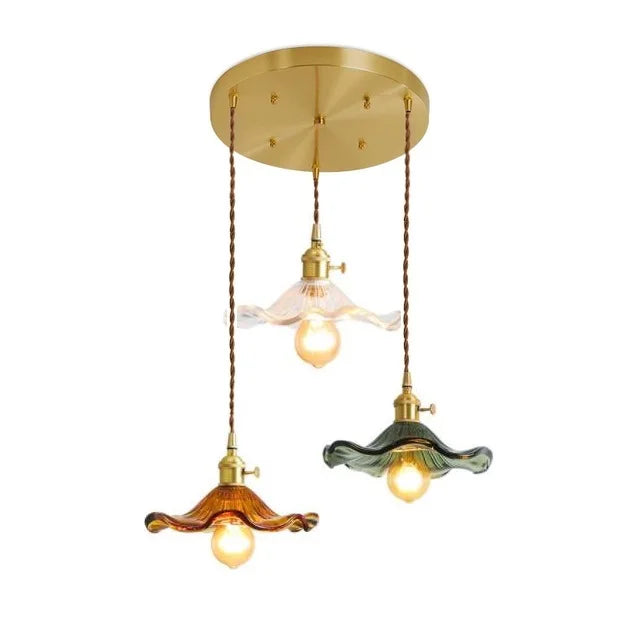 Three-bulb emerald glass pendant light in a warm vintage style