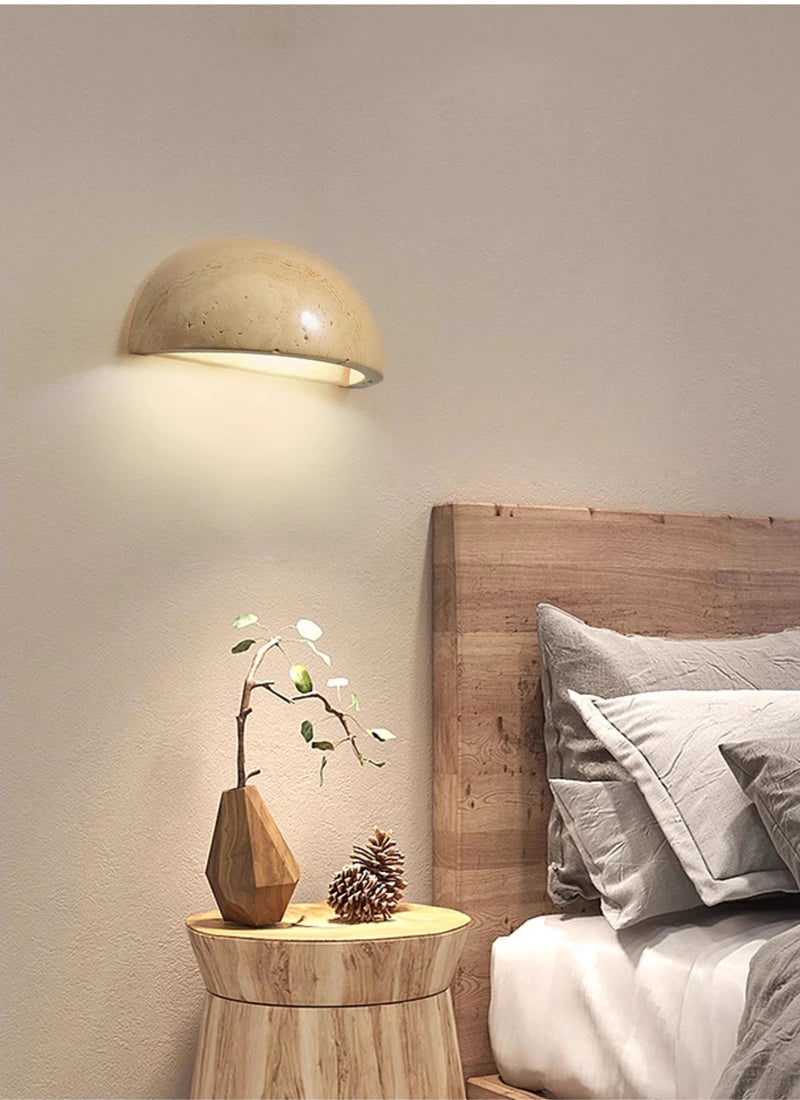 Semi-circular travertine wall light for warm, natural ambient light