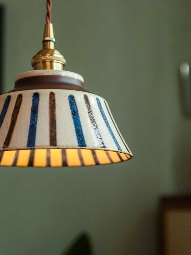 Ceramic pendant light with hand-painted striped pattern