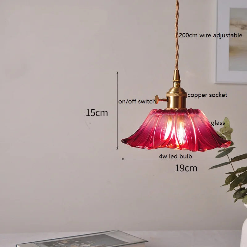 Vintage glass pendant lamp with brass details in warm red