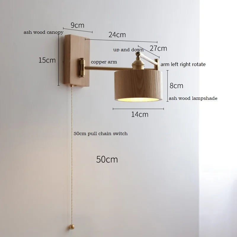 Walnut wall lamp with rotating arm and warm cylindrical shade