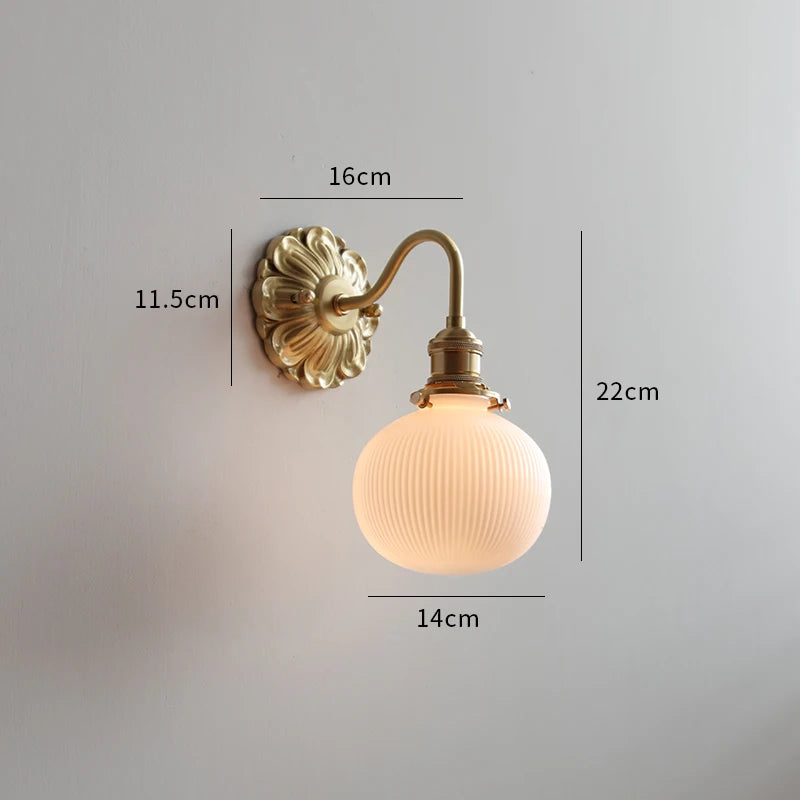 Vintage wall lamp with ribbed glass and warm brass arm