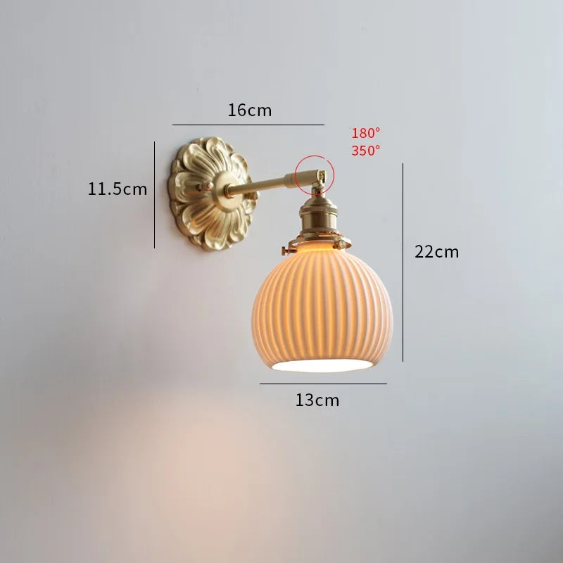 Elegant vintage wall lamp made of opal glass with a rotating brass arm
