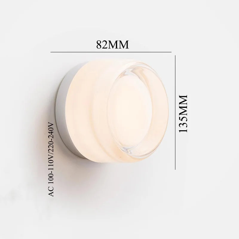 Round acrylic wall lamp with a soft vintage glow.