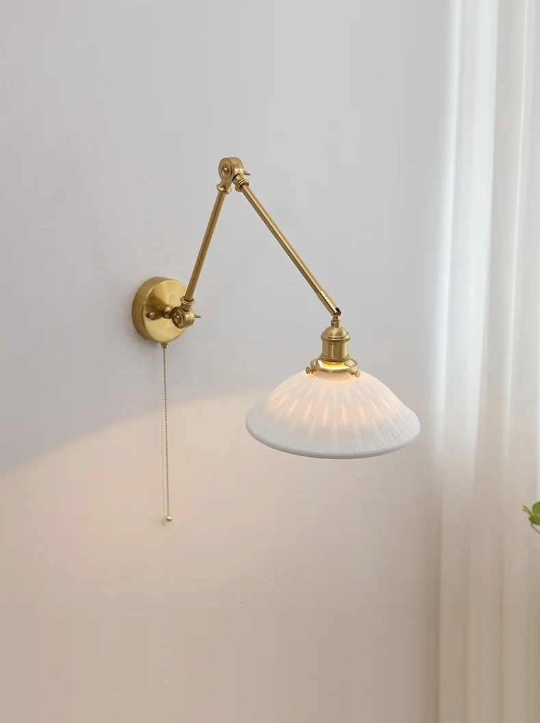 Vintage brass wall lamp with a wide ceramic shade