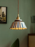 Ceramic pendant light with hand-painted striped pattern