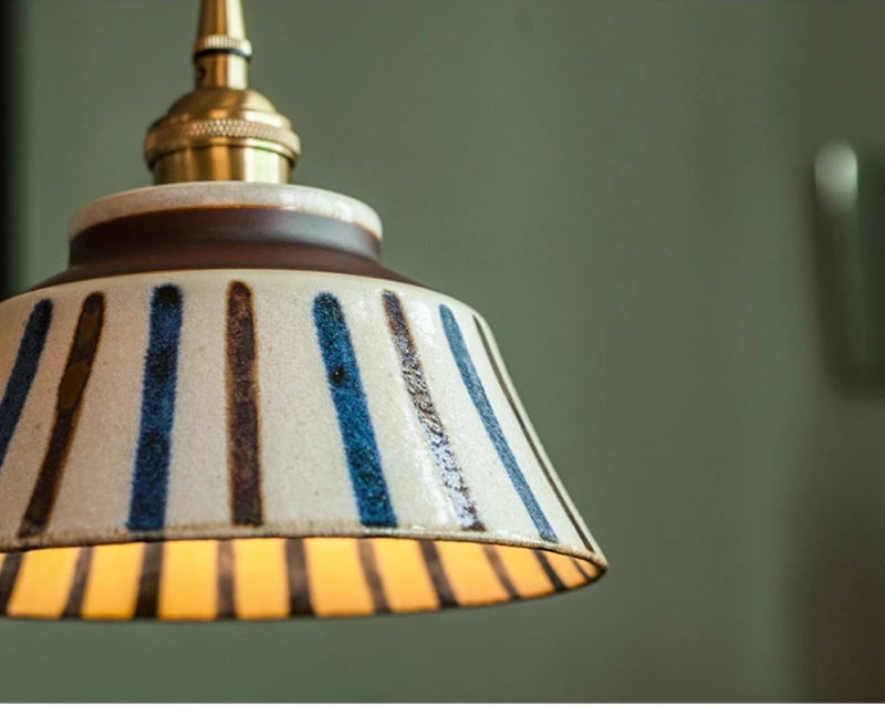Ceramic pendant light with hand-painted striped pattern