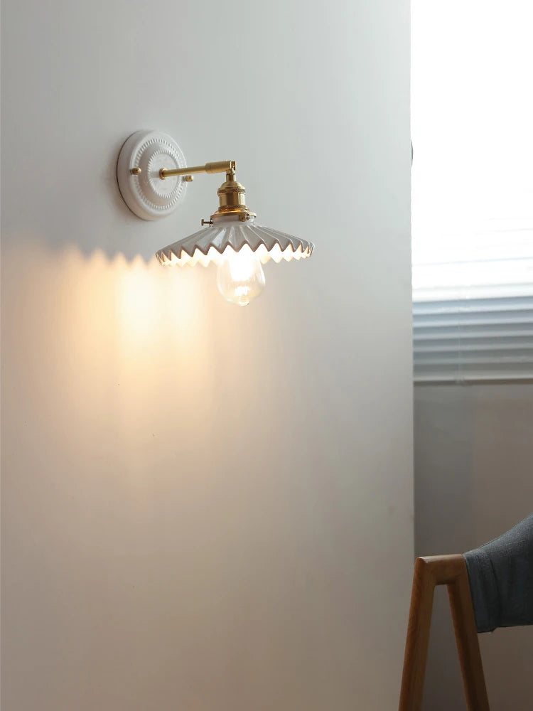 Ceramic wall lamp with brass arm and zigzag vintage shade