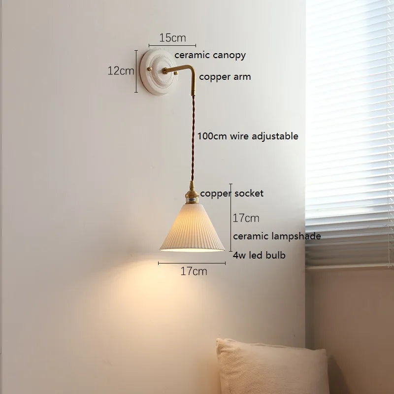 Ceramic wall lamp with rotating copper arm in a warm vintage look