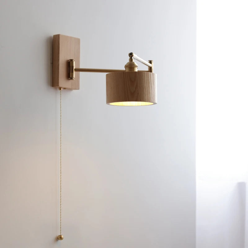 Walnut wall lamp with rotating arm and warm cylindrical shade