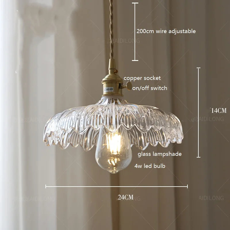 Clearly structured vintage glass hanging light with brass and wavy edge