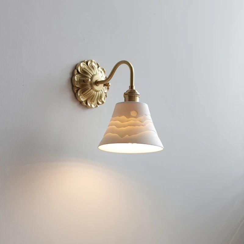 Vintage wall lamp with ceramic shade and elegant brass arm